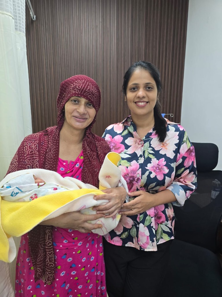 Obstetrician Dr Maincy Jain with mother and newborn at Navkar Clinic Sector 63 Gurugram
